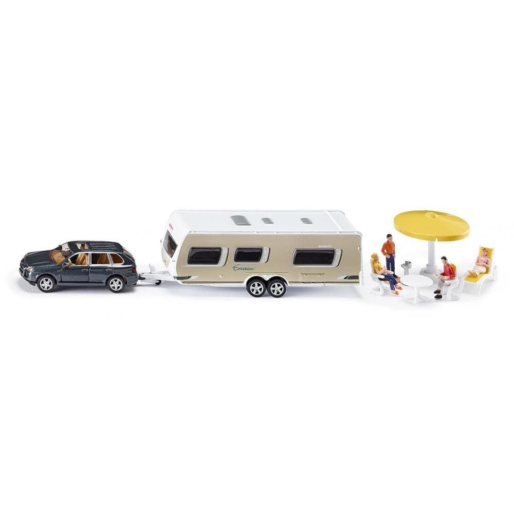 Car with caravan, toy figures and camping equipment